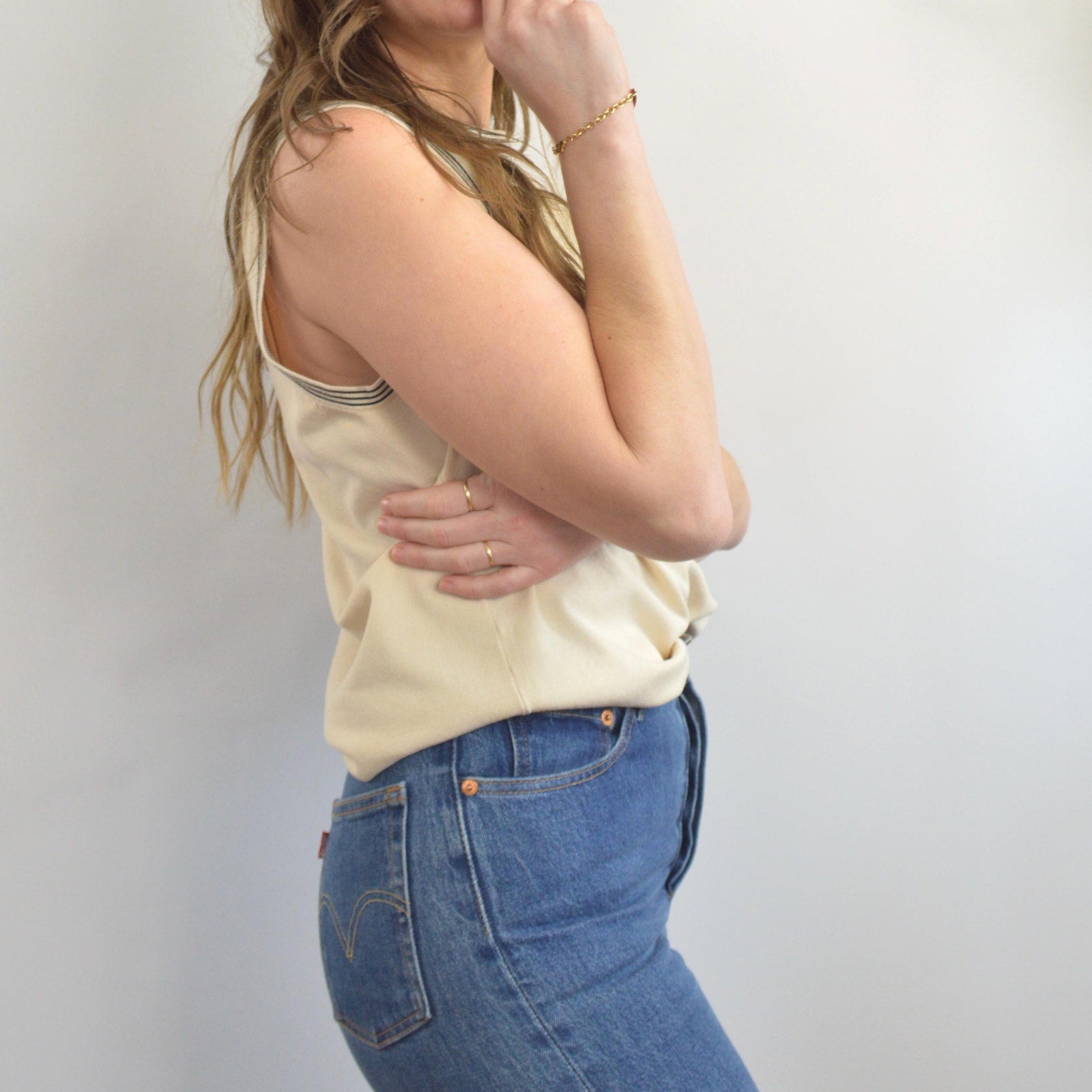 sweater knit silk blend tank with black striped banding around neck and sleeves