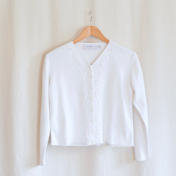 white cotton blend with embroidered floral detail