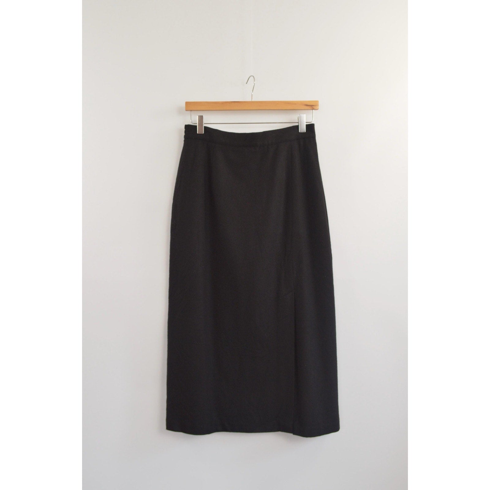medium black wool midi skirt with off center front slit and full lining
