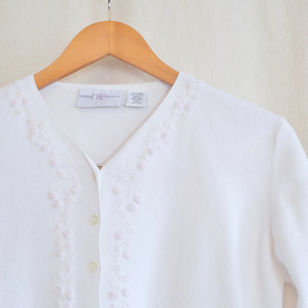 white cotton blend with embroidered floral detail