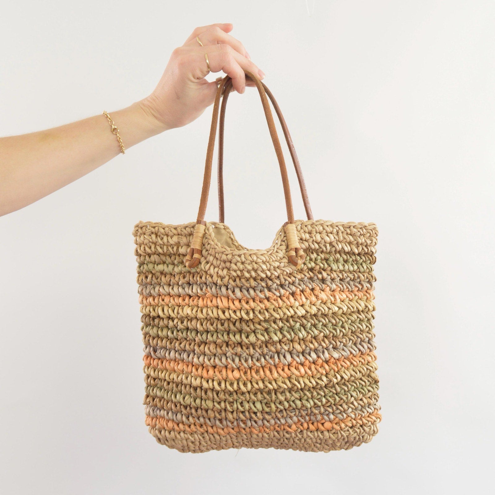 olive, blue and peach striped straw bag with leather handles