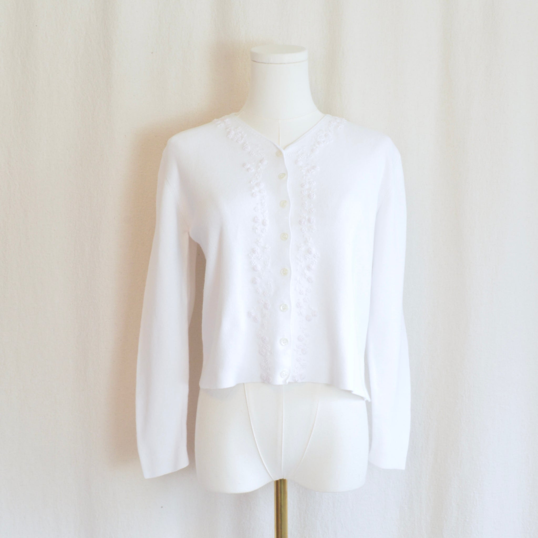 white cotton blend with embroidered floral detail