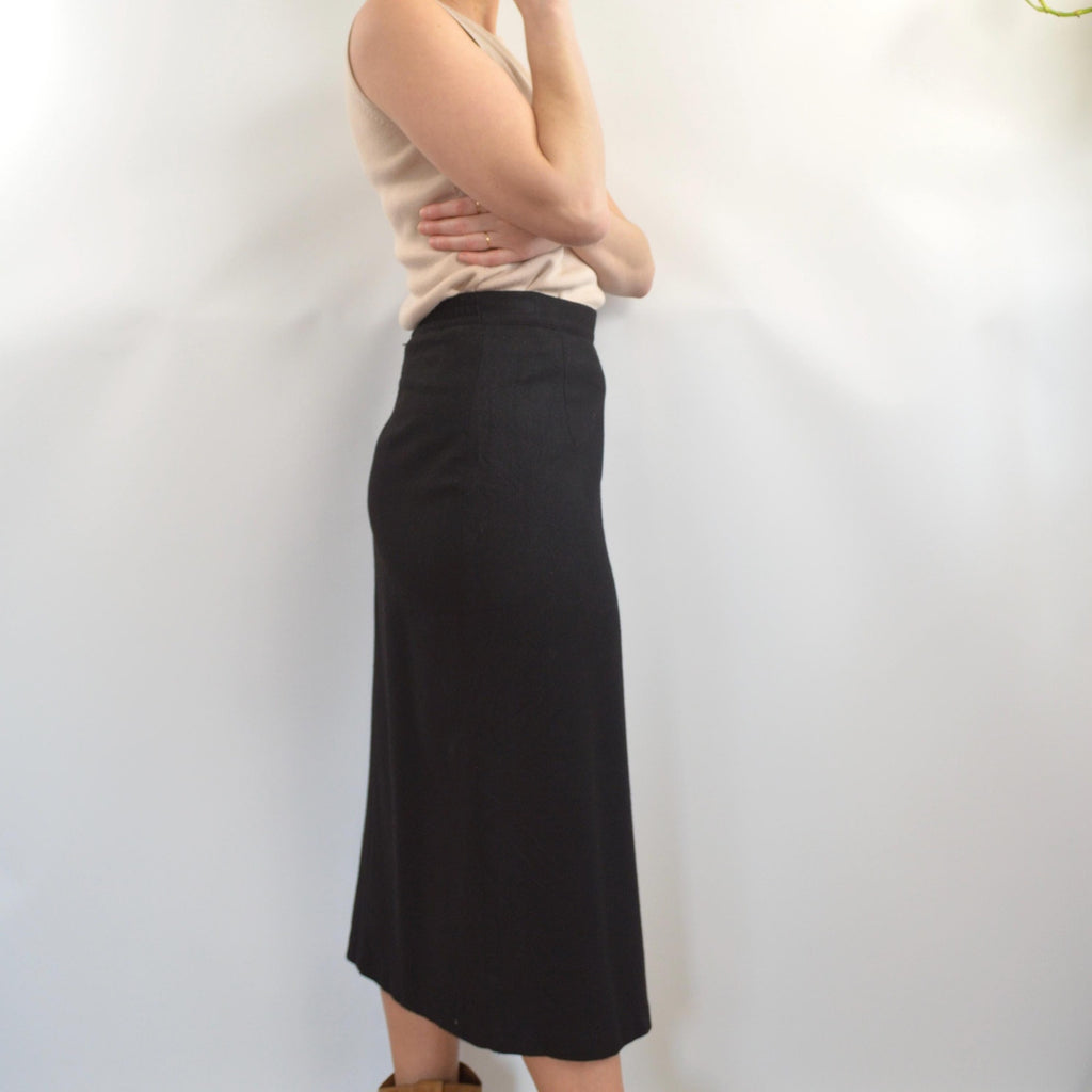 medium black wool midi skirt with off center front slit and full lining