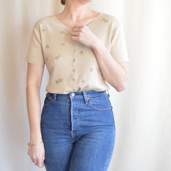beige button down sweater tee with sage floral embroidery details