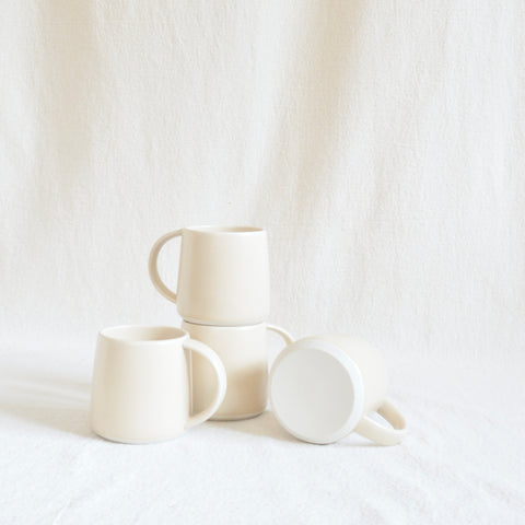 set of four beige kinto mugs