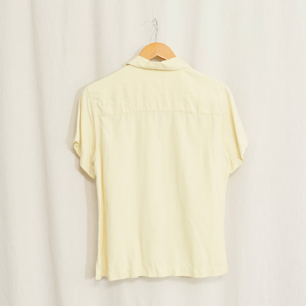 simple buttercream yellow button down short sleeve silk blouse