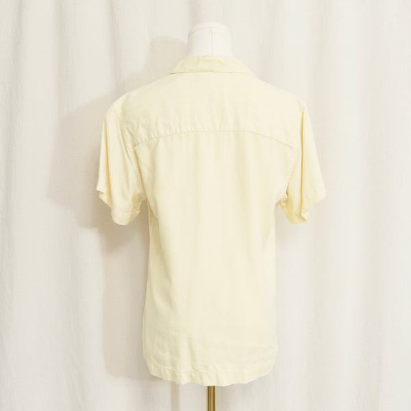 simple buttercream yellow button down short sleeve silk blouse