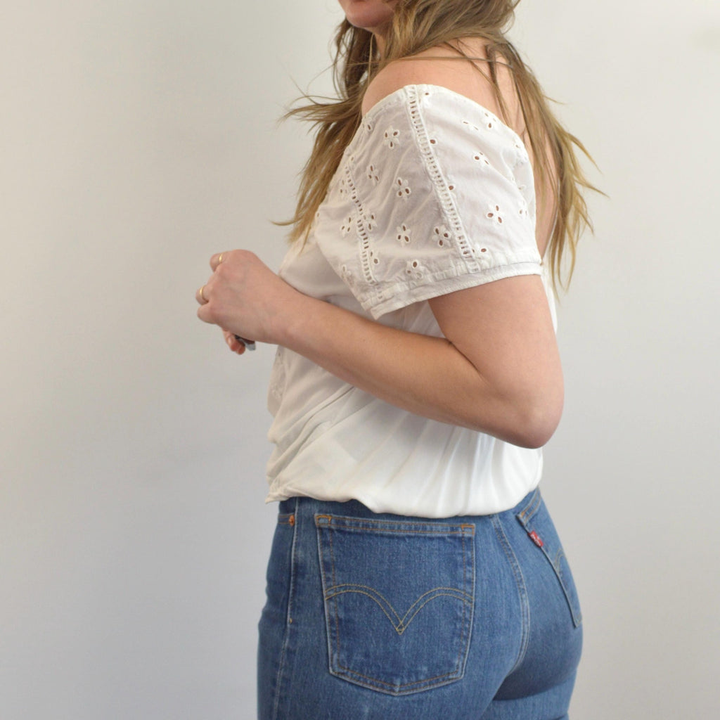 white vintage eyelet off the shoulder button down crop blouse