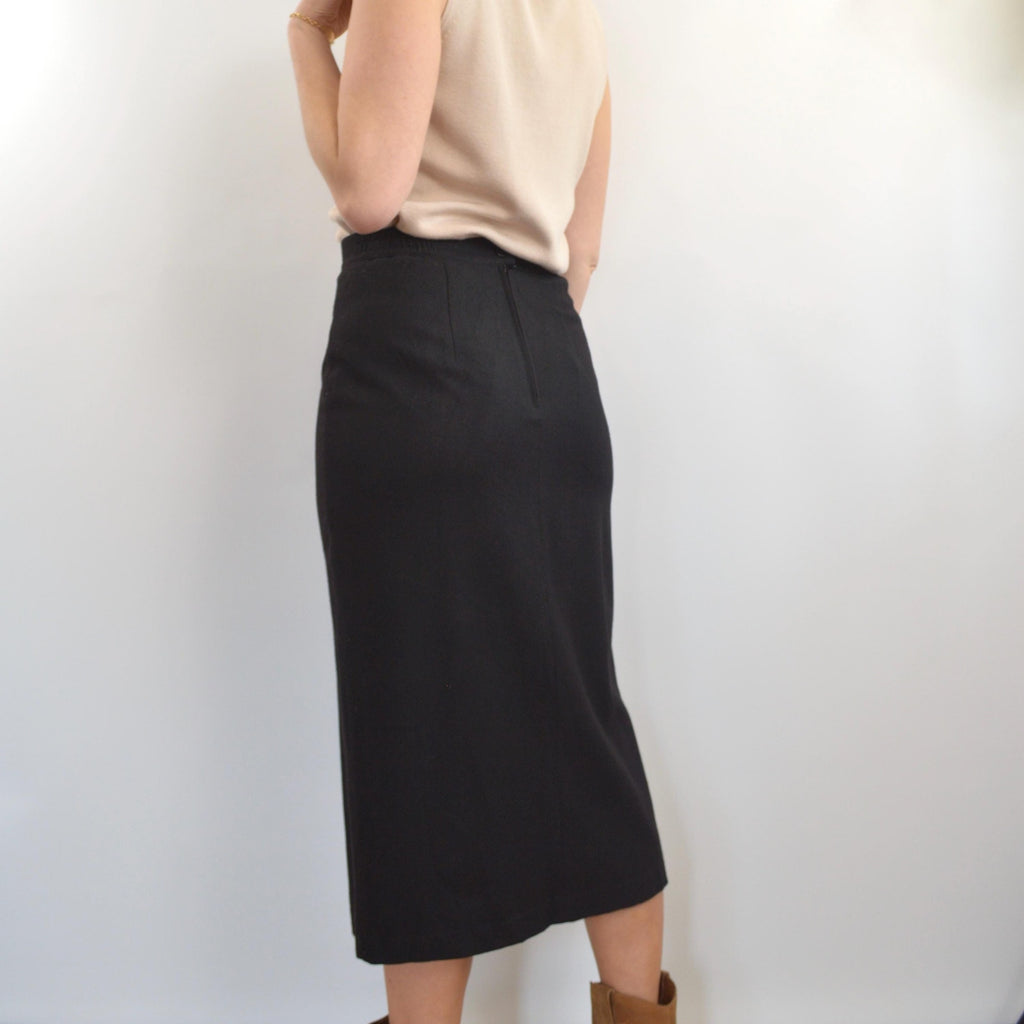 medium black wool midi skirt with off center front slit and full lining