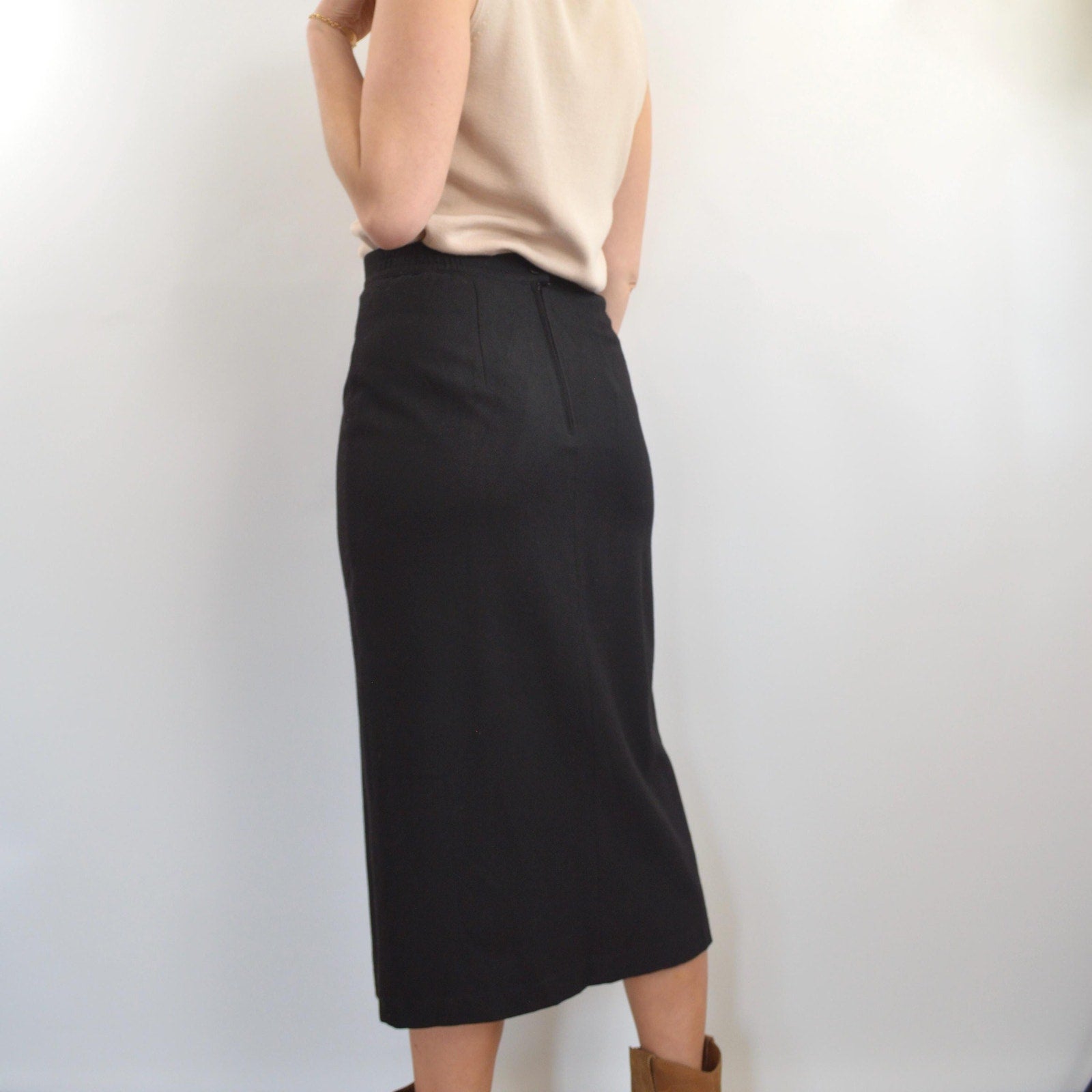 medium black wool midi skirt with off center front slit and full lining