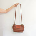 medium cognac brown woven shoulder bag